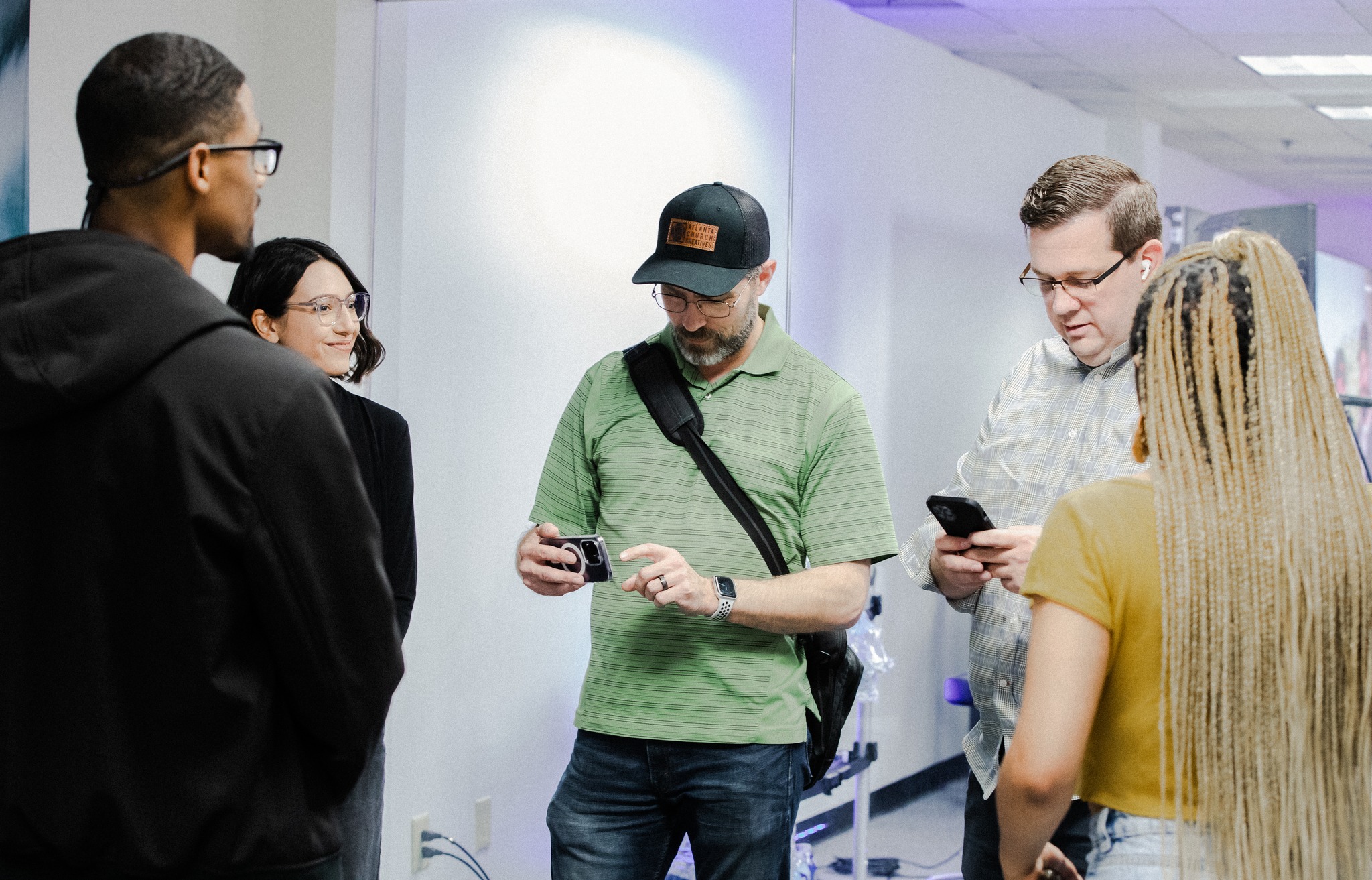 ACC creatives gathered around a project conversation